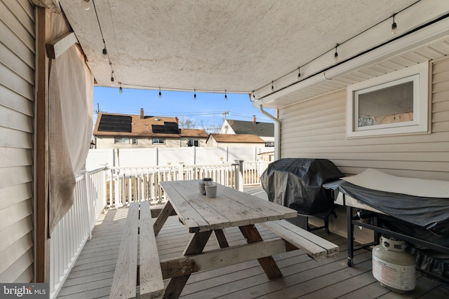 wooden deck with grilling area