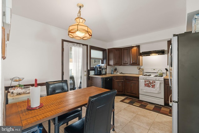 kitchen featuring range hood, dishwasher, stainless steel fridge, hanging light fixtures, and white range with gas cooktop