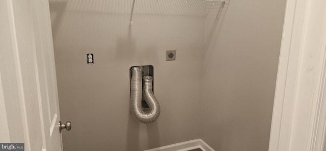 laundry room featuring laundry area, electric dryer hookup, and baseboards