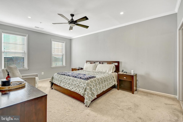 carpeted bedroom featuring ornamental molding and ceiling fan