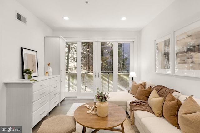 living area with hardwood / wood-style floors