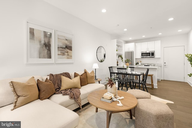 living room with light hardwood / wood-style flooring