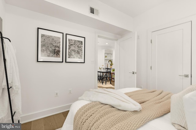 bedroom with light hardwood / wood-style floors