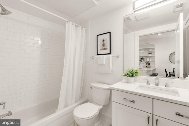 full bathroom with vanity, shower / tub combo with curtain, and toilet