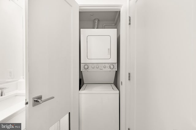 washroom with stacked washer / dryer