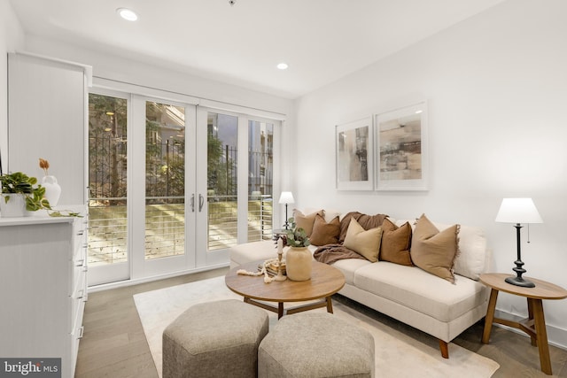 living room with hardwood / wood-style flooring and a healthy amount of sunlight