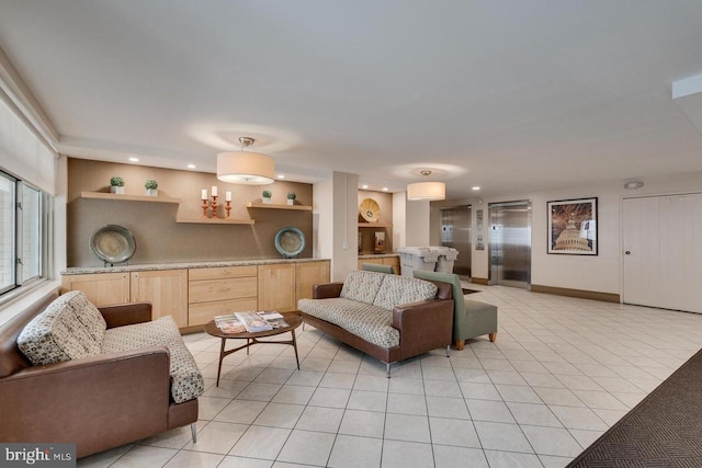 living area featuring recessed lighting, baseboards, and light tile patterned floors