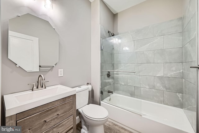 full bathroom with enclosed tub / shower combo, vanity, and toilet