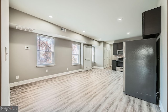 kitchen featuring stainless steel appliances and light hardwood / wood-style floors