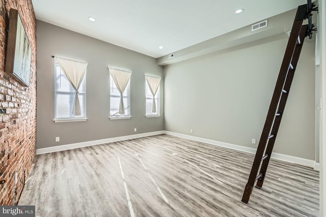 spare room with light hardwood / wood-style floors