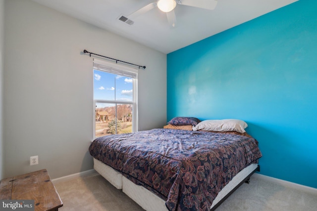 bedroom featuring ceiling fan, carpet, visible vents, and baseboards