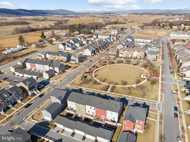 drone / aerial view featuring a residential view and a mountain view