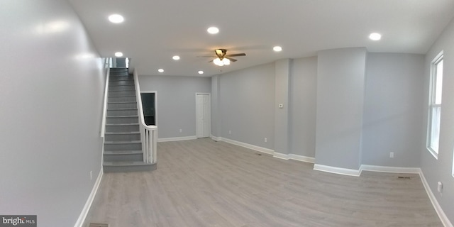 interior space with ceiling fan and light hardwood / wood-style flooring