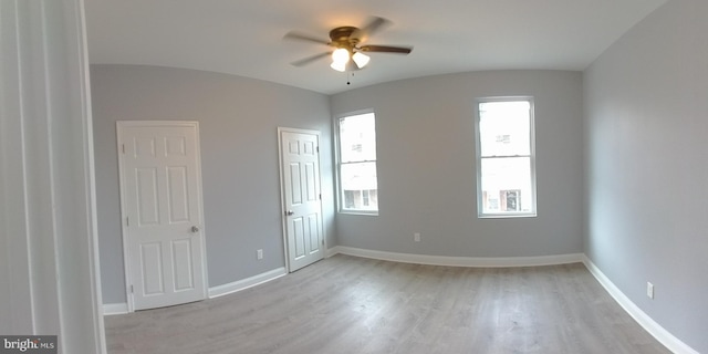 spare room featuring ceiling fan and light wood-type flooring