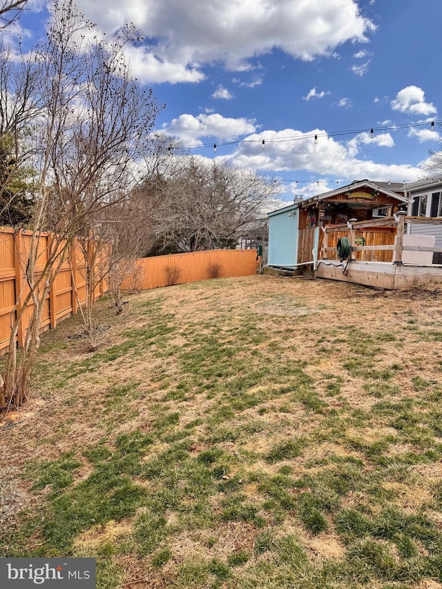 view of yard with a fenced backyard