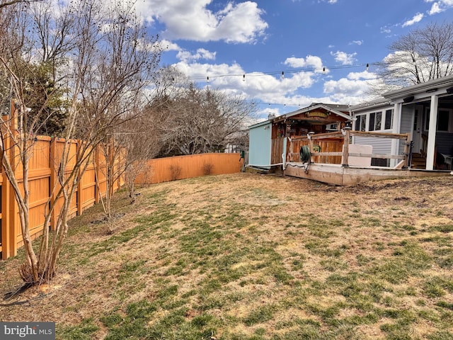 view of yard with a fenced backyard