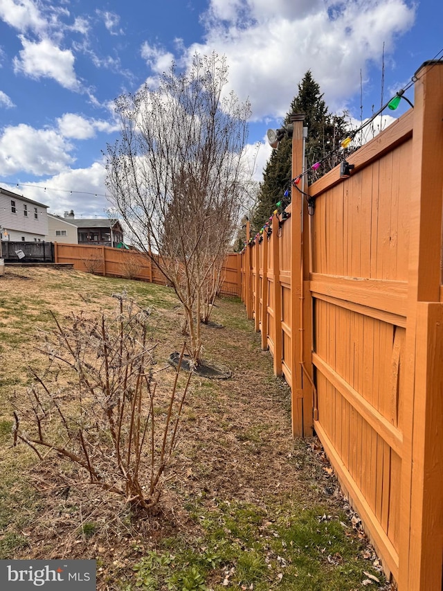 view of yard with a fenced backyard