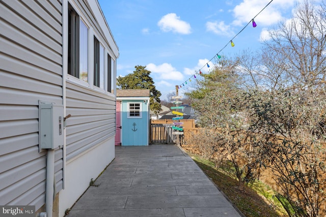 exterior space with fence and a wooden deck