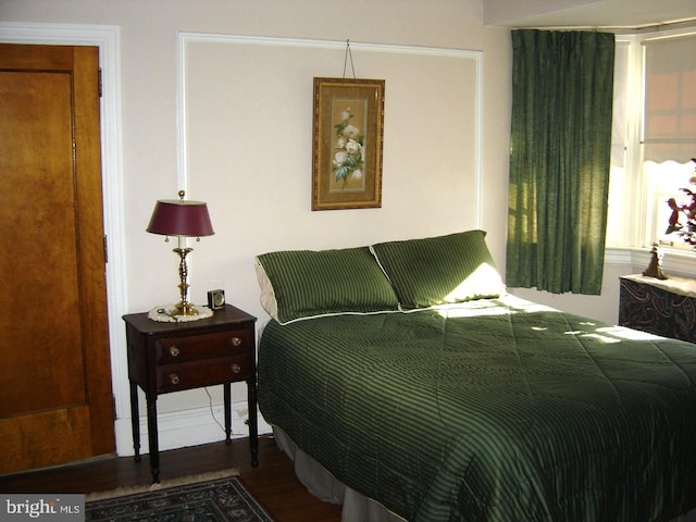 bedroom featuring hardwood / wood-style floors