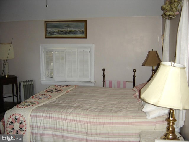 bedroom featuring radiator