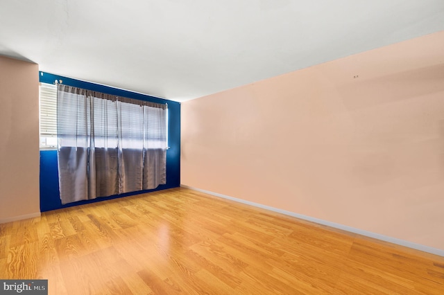 spare room featuring light hardwood / wood-style floors