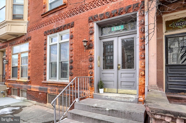 view of exterior entry featuring french doors