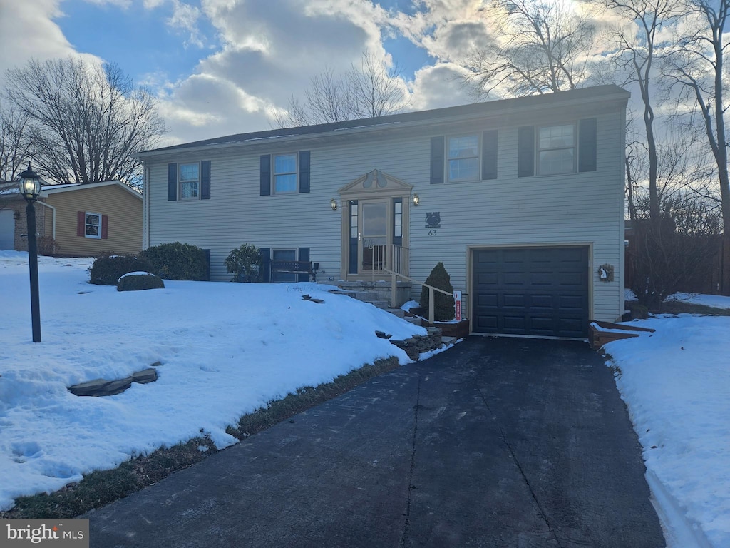 bi-level home featuring a garage