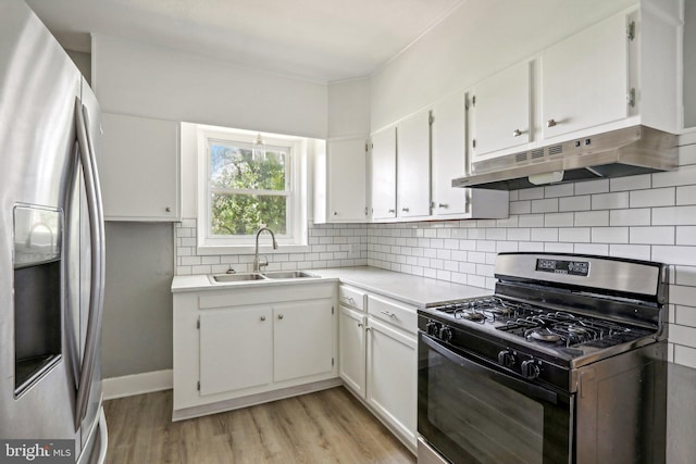 384 Wheat Rd, Vineland, NJ 08360 - kitchen with white cabinetry, appliances with stainless steel finishes, sink, and light wood-type flooring
