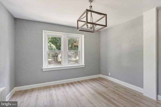 384 Wheat Rd, Vineland, NJ 08360 - interior space with a notable chandelier, light hardwood / wood-style flooring, and radiator