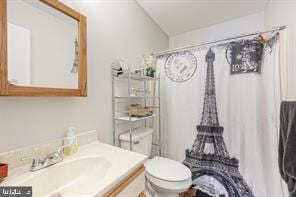 bathroom featuring vanity and toilet