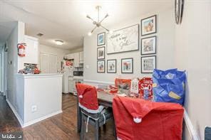 dining area with dark hardwood / wood-style floors