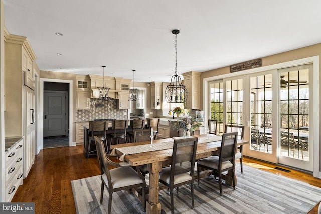 dining room featuring dark hardwood / wood-style floors, sink, and french doors