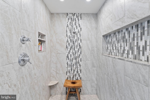 bathroom featuring tiled shower