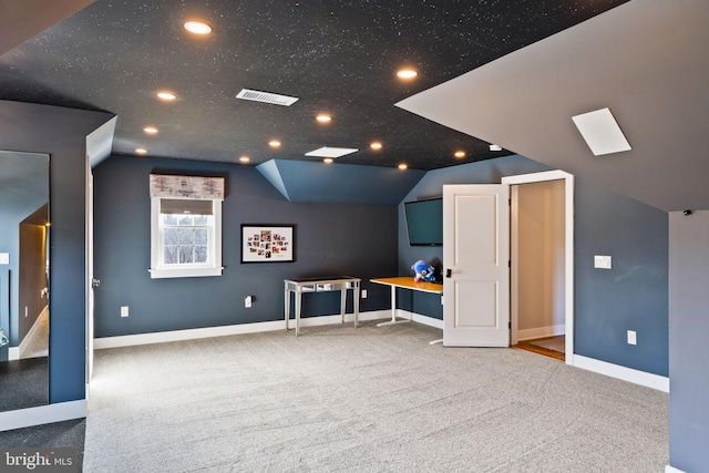 bonus room featuring lofted ceiling, carpet, and a textured ceiling