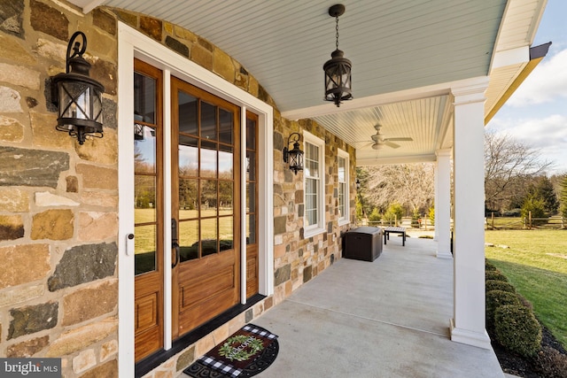 view of patio / terrace with ceiling fan and a porch