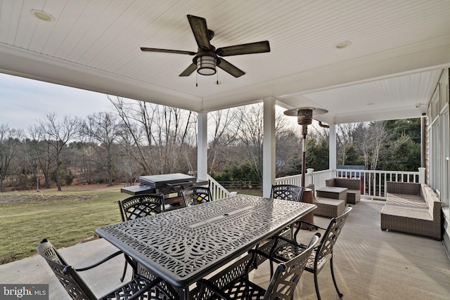 view of patio / terrace featuring area for grilling, an outdoor living space, and ceiling fan