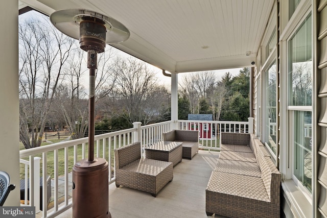 view of patio featuring an outdoor living space and an outbuilding