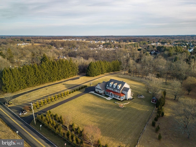 birds eye view of property with a rural view