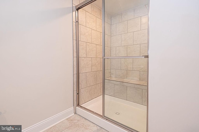 bathroom featuring an enclosed shower