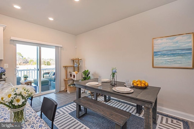 dining space featuring hardwood / wood-style flooring