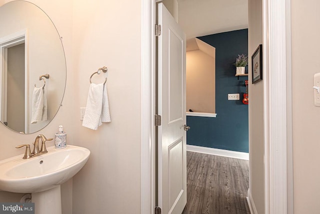 bathroom featuring hardwood / wood-style flooring and sink