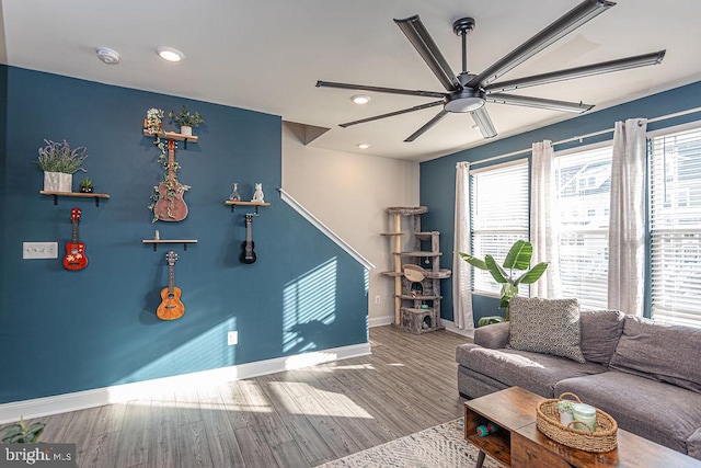 game room with wood-type flooring and ceiling fan