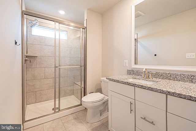 bathroom with walk in shower, vanity, and toilet