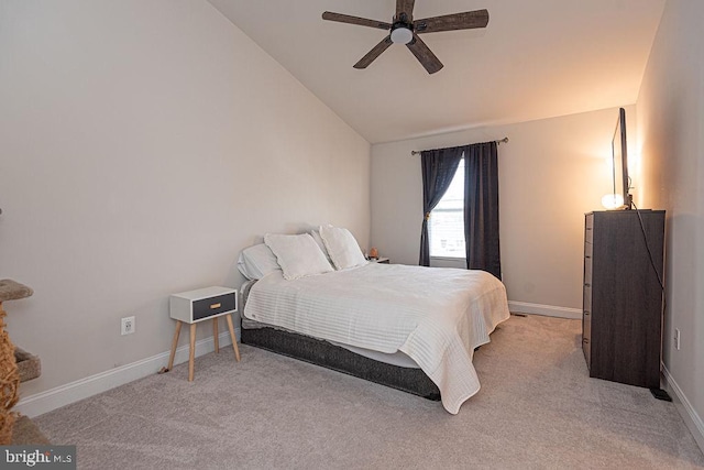 carpeted bedroom featuring lofted ceiling and ceiling fan