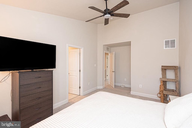 bedroom with light colored carpet and ceiling fan