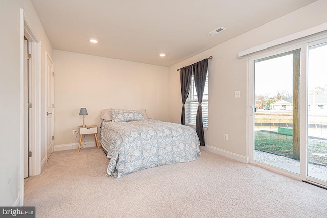 carpeted bedroom with access to exterior