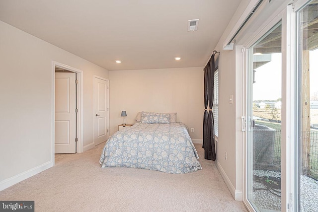 carpeted bedroom featuring access to outside