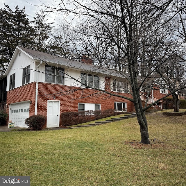 view of home's exterior featuring a garage and a lawn