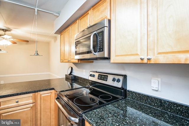 kitchen with ceiling fan, light brown cabinets, pendant lighting, and stainless steel appliances