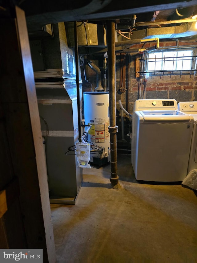 utility room featuring independent washer and dryer and gas water heater